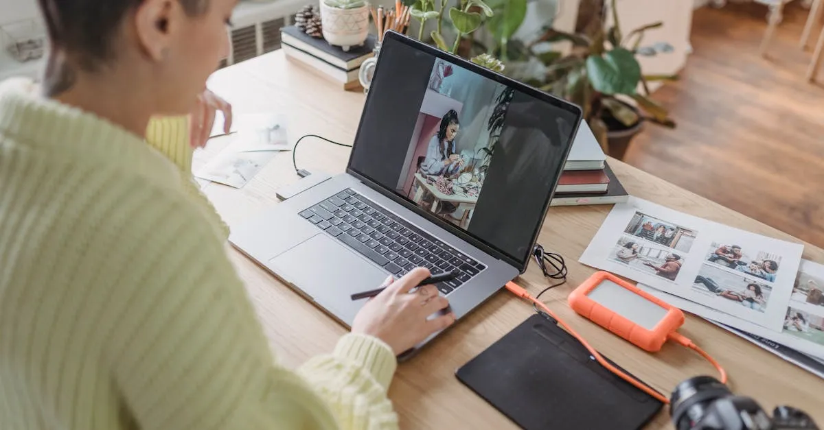 Person editing and resizing photos on a laptop screen at a tidy desk workspace