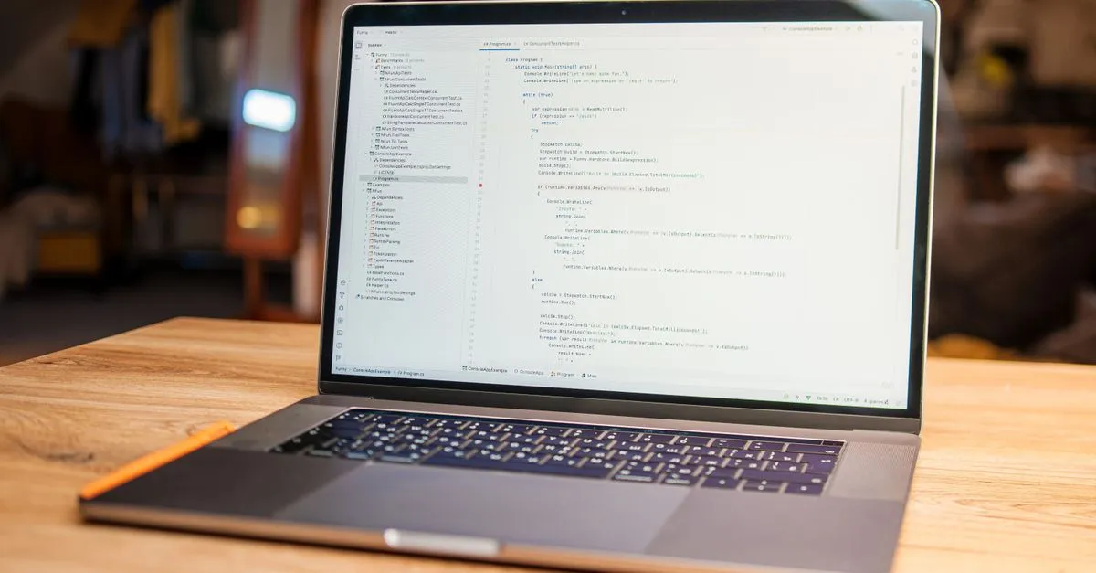 Developer editing a Markdown table in code documentation on a laptop at a desk